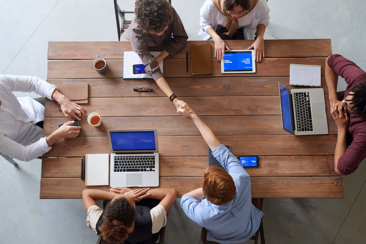Team of professionals coordinating work together at a table