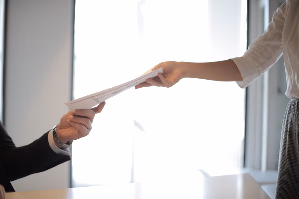 Property manager reviewing bookings on laptop with calm confidence