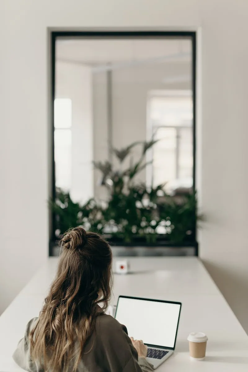 Host analyzing vacation rental guest reviews on computer