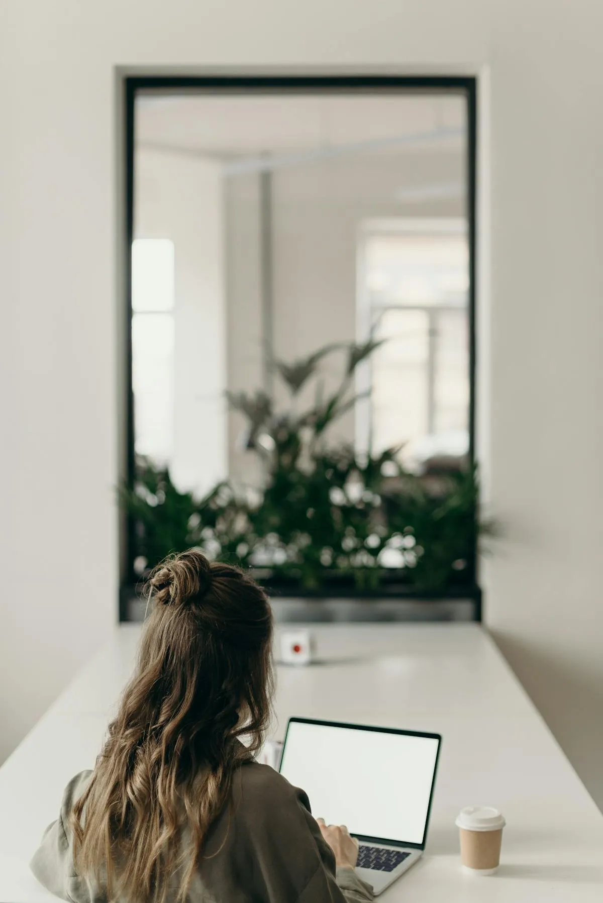 Host analyzing vacation rental guest reviews on computer