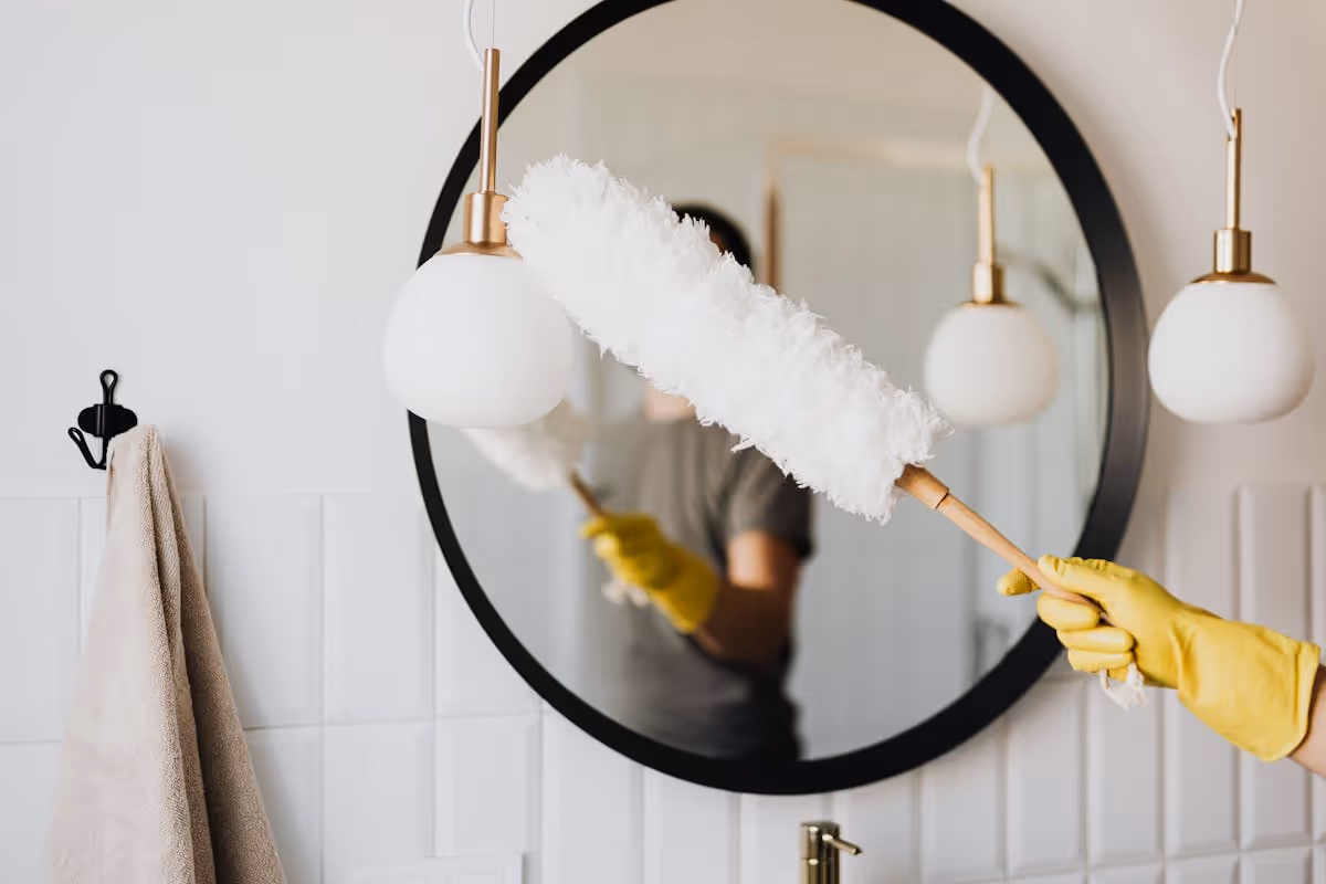 Remote host verifying cleaning quality of vacation rental through photo checklist on smartphone