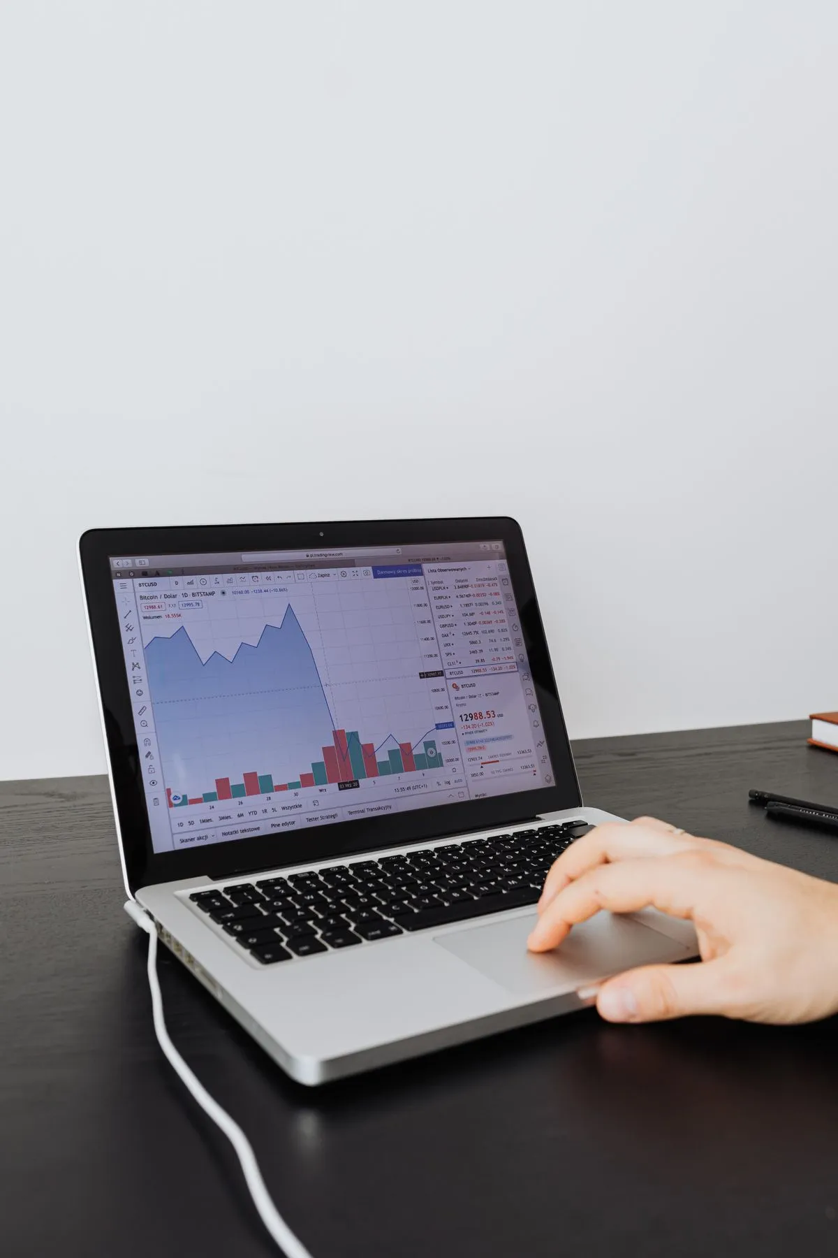 Host analyzing pricing data on a laptop for a new listing