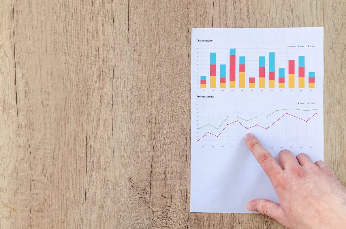 Person pointing at performance graph showing vacation rental KPIs