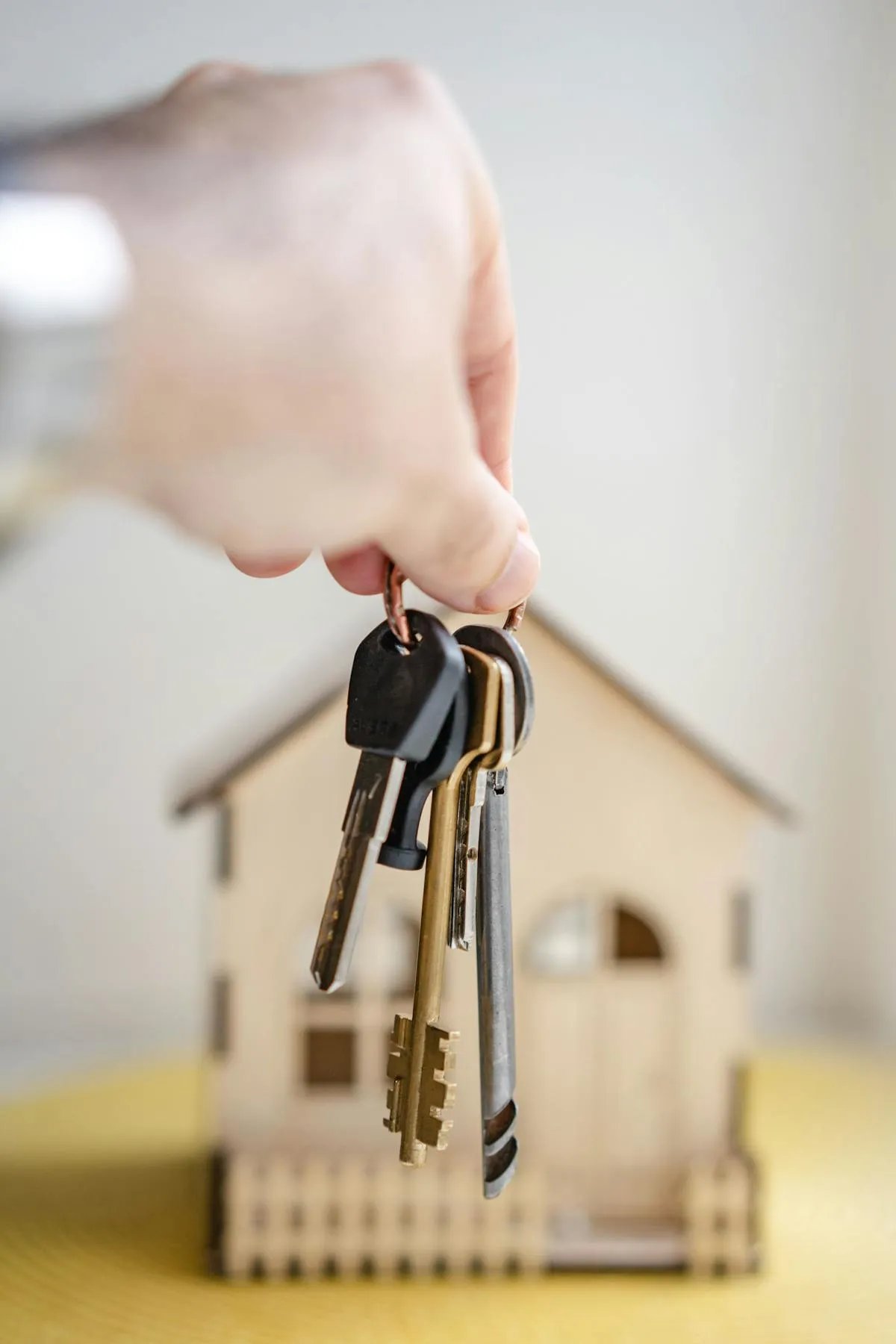 Person holding real estate keys