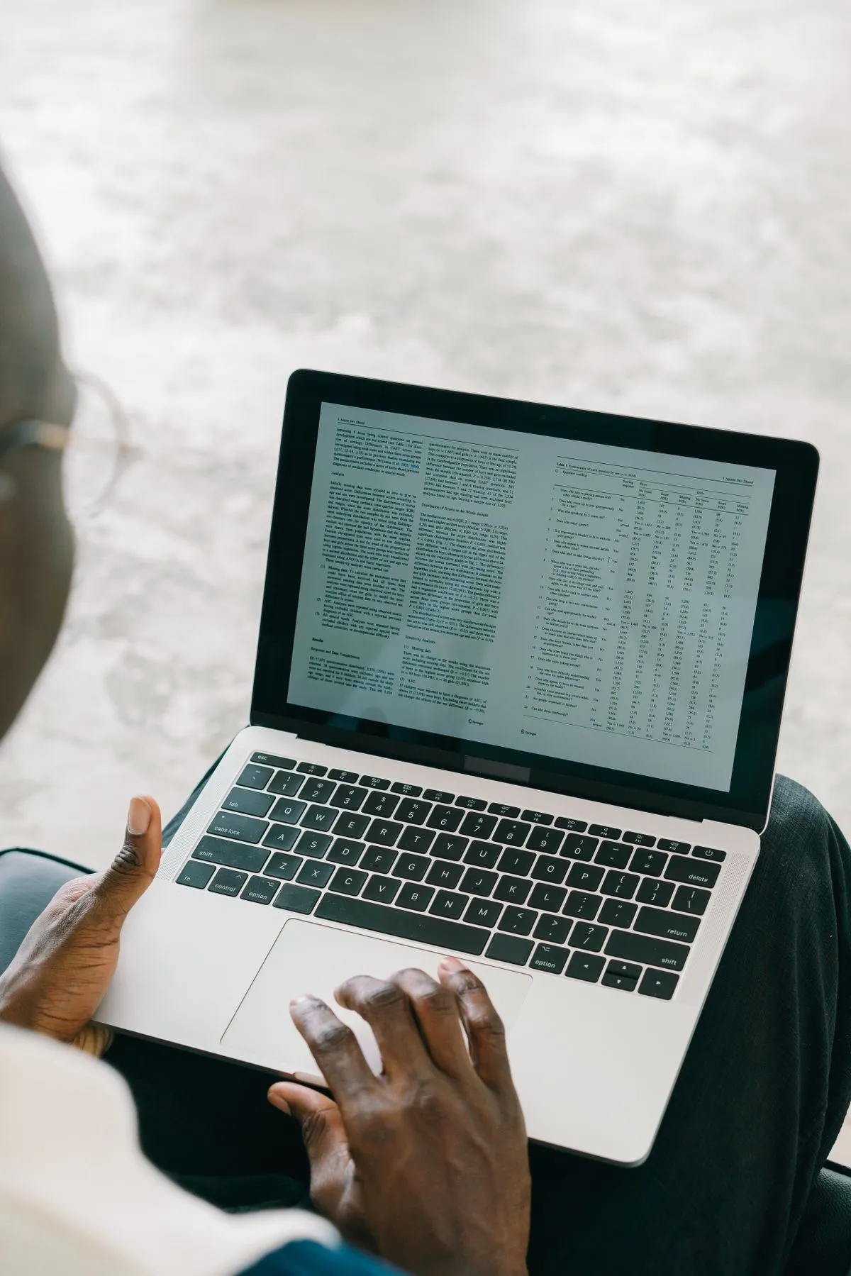 Person on a laptop reviewing an exported table of vacation rental bookings before leaving Smily
