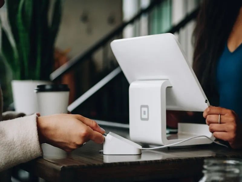 Property manager reviewing guest loyalty program metrics on tablet